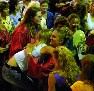 Maureen Tacke gets a hug from a fellow student.