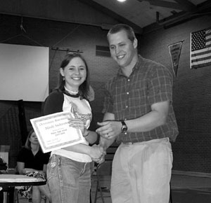 Mindy Anderson receives the Science award from Bruce Nuxoll, who was awarded as Teacher of the Year.