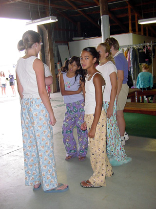 Models in the constructed clothing division await their turn with the judges on Monday.