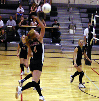 Natalie Arnzen spikes the ball.