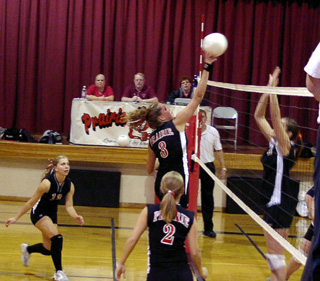 Briget Long spikes the ball against Kendrick.