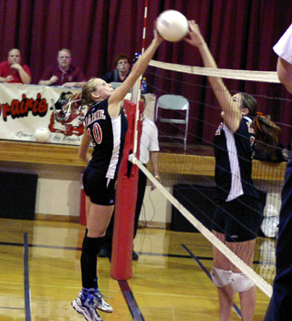 Ashley Schaeffer battles a Kendrick player at the net.