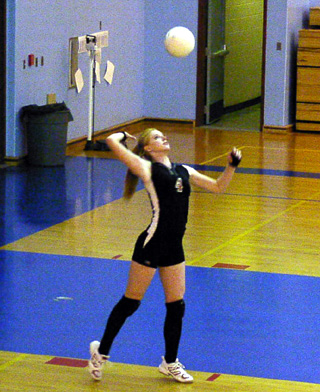 Natalie Arnzen serves up an ace during her match ending serving run.