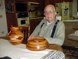 Alphonse Uhlenkott with some of his woodworking projects.
