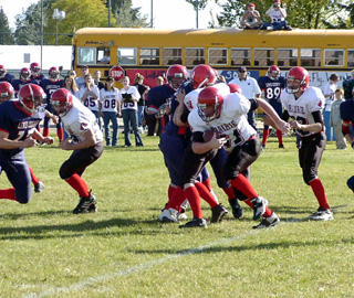 Eric Lerandeau carries the ball for short yardage.