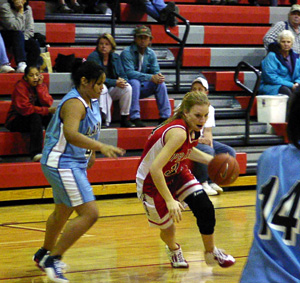 Brittny Behler drives toward the hoop.