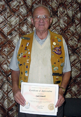 Carl Schmidt with his certificate.