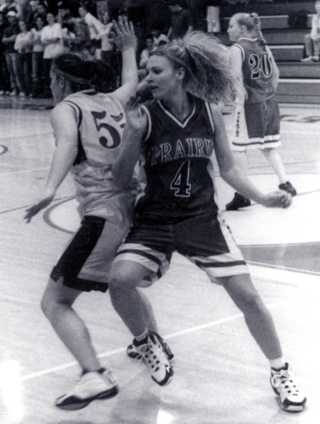 Bridget Enneking battles a Nezperce player for position.