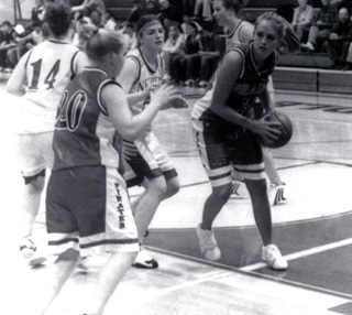 Briget Long has the ball with Lauren Merrill looking to receive a pass.