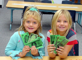 Kelsey and Kylie Tidwell won cash for their sales efforts.