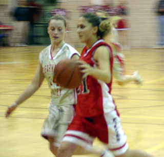 Nicole Nida drives toward the hoop after one of her seven steals.