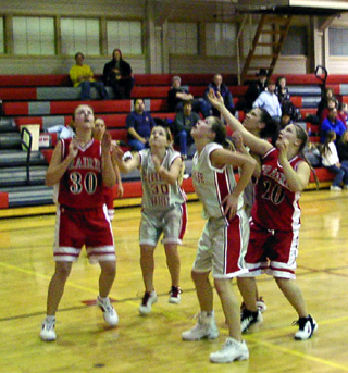 Ashley Schultz and Meghan VanderPas wait for the a rebound.