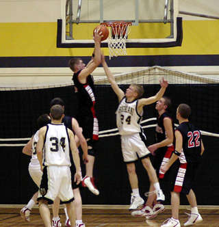 Chad Arnzen leaps high for a defensive rebound.
