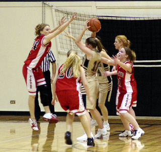 Prairie defenders swarm to the ball at Highland.