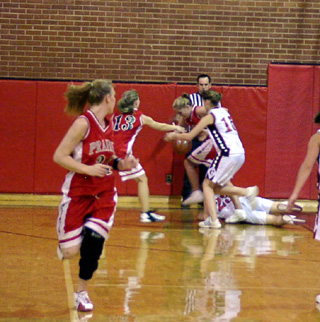 Brittny Behler anticipates the turnover being forced by Briget Long.