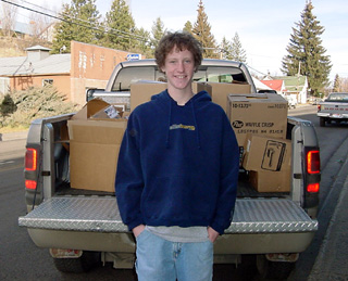 Tyler Forsmann with the pickup load of food the Middle School students collected.