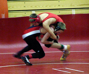 Shane Poxleitner grabs a leg as he goes for a takedown.