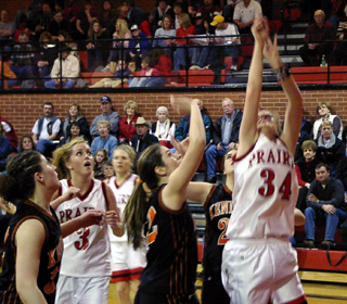 Brittny Behler shoots a lay-up as Briget Long looks on.