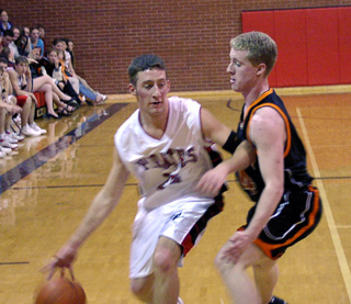 Kevin Funke wards off a Kendrick defender.
