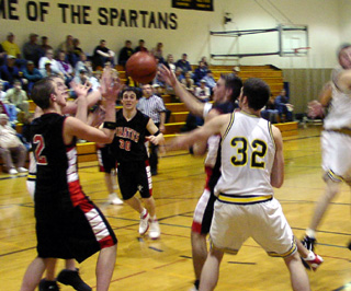 Seth Crane and Mat Forsmann go after a loose ball as Kelby Wilson looks on.