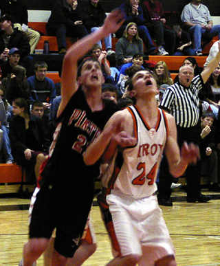 Corey Schaeffer battles for a rebound at Troy.