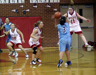 Ashley Jackson gets some serious air as she defends against Lapwai. Vanessa Sonnen and Meghan VanderPas area also shown.