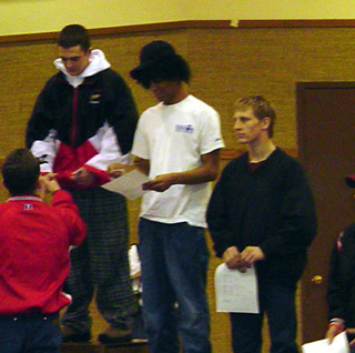 Shane Poxleitner, right, after receiving his third place medal.