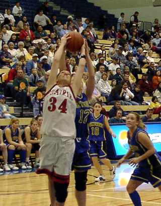 Brittny Behler battles for a rebound against Genesee.