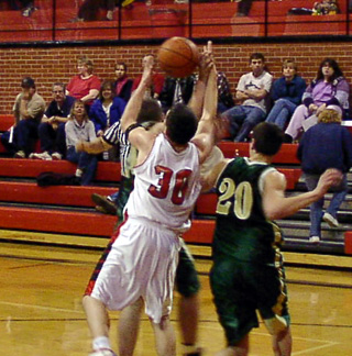 Kelby Wilson battles for a rebound against Culdesac.