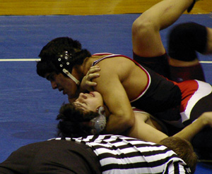 Richard Sonnen is about to score the pin the clinched him a trip to state.