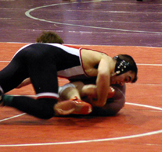 Nick Uhlenkott battles Tyler Jackson of Kamiah in the consolation semifinals.