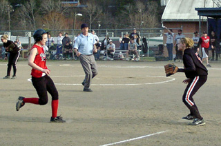 Kylie Uhlorn cruises into third after hitting a 2-run triple against Priest River.