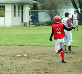 Mat Forsmann heads into second after hitting a 2-run double.