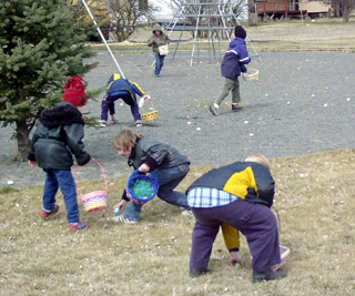 The 5 to 8 year olds scramble for eggs.