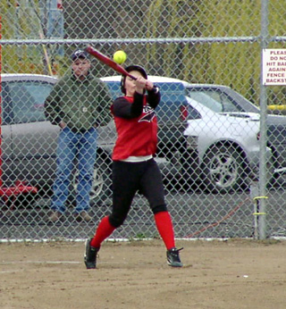Brooke Holthaus goes after a high pitch.
