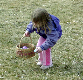 This young lady adds another egg to her collection which looks like it includes a plastic prize egg.