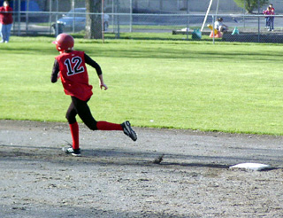 Ashley Schaeffer rounds second on a home run.