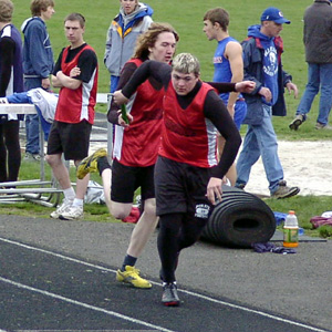 Kyle Groom hands off to Nick Johnson in the 4x400 relay.