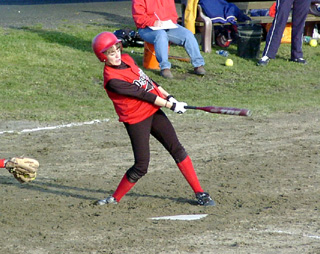 Alli Holthaus takes a cut during the girls game at Lewis County.