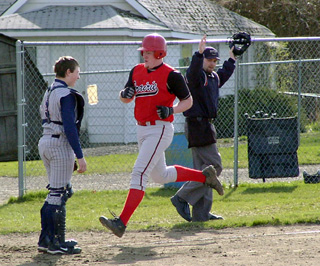 Eric Lerandeau apparently scores on a homer but wound up being sent back to second with a ground-rule double.