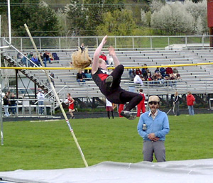 Lauren Merrill clears the bar in the pole vault.