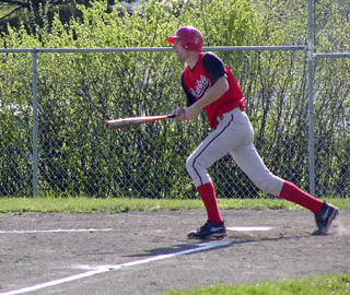 Chad Arnzen watches his homer sail toward the fence in right center.