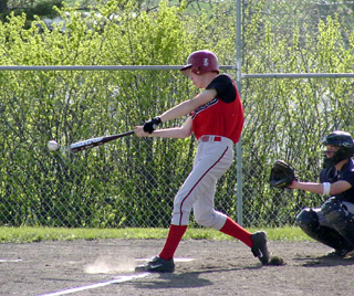 C.J. Rieman about to connect for the triple mentioned in the other photo.