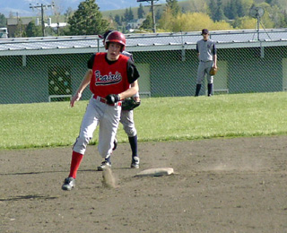 C.J. Rieman rounds second as he runs out a triple against Lewis County.