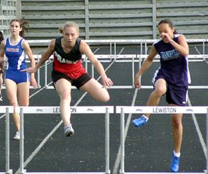 Tabitha Sonnen leads Grangeville's Mary Truong in the 300 hurdles.