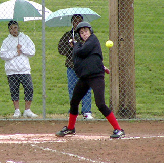 Alli Holthaus ducks out of the way of an inside pitch.