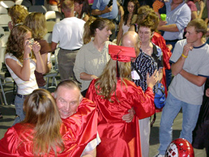 More hugs for graduates.