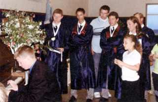 Joseph Uhlenkott performs a song he wrote and dedicated to the grads.