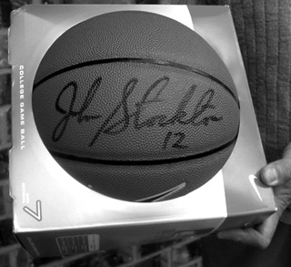 A closeup of the ball showing John Stockton's signature.