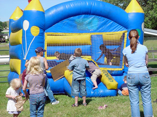 Kids enjoy the jumping castle.